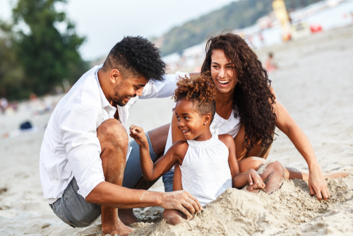 family-having-fun-in-the-sand