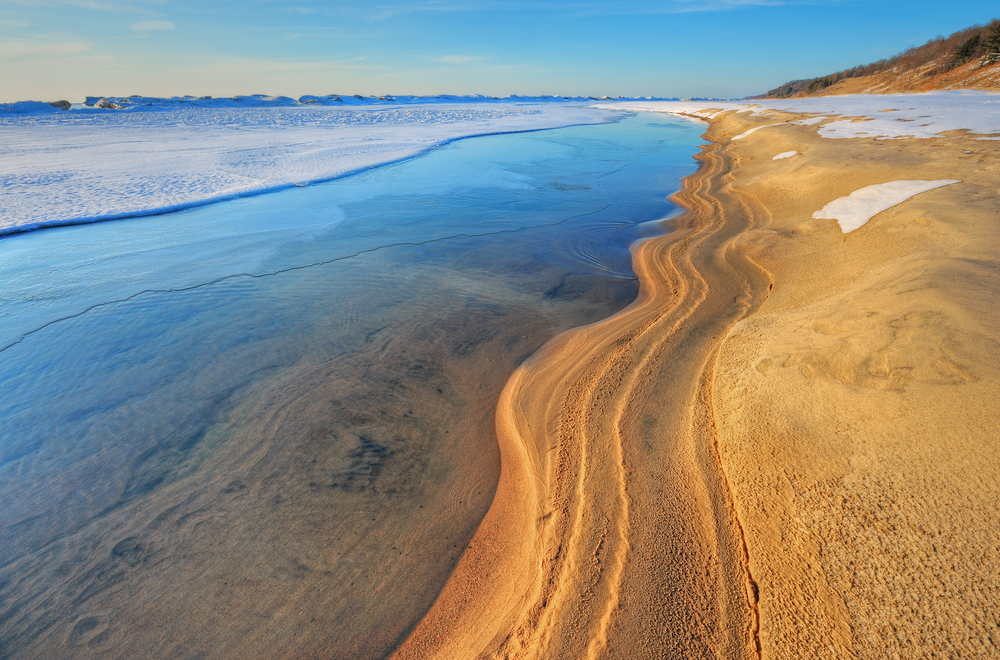 The icey shoreline found in Saugatauck is a must-see attraction when planning weekend getaways from Chicago.