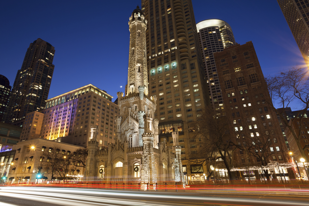 Image of the Chicago Water Tower and Michigan Avenue during twilight blue hour in Chicago.