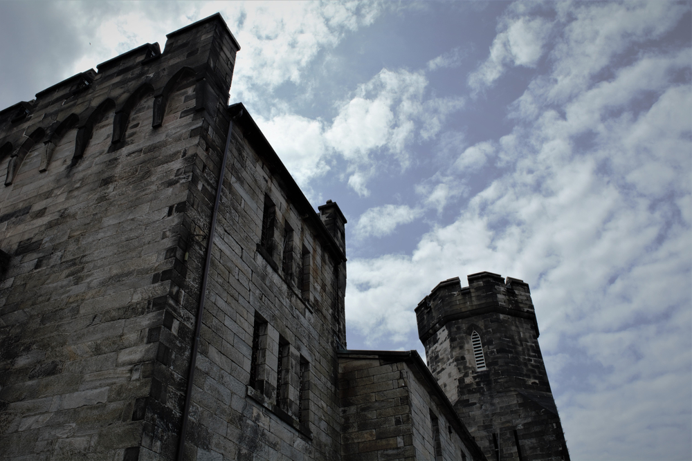 The daunting Eastern State Penitentiary as seen from the outside on a clear day.