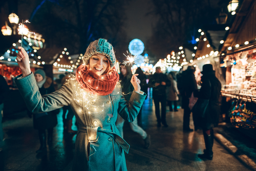 woman-surrounded-in-christmas-lights