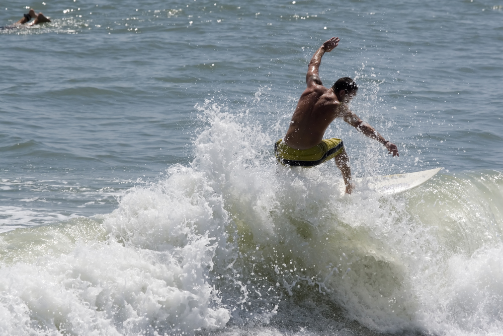 Surfer enjoying fun things to do in Cocoa Beach, Florida.