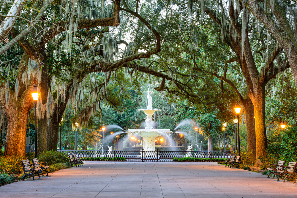 Savannah, Georgia: Forsyth Park Fountain in the center of Spanish moss draped live oak trees.