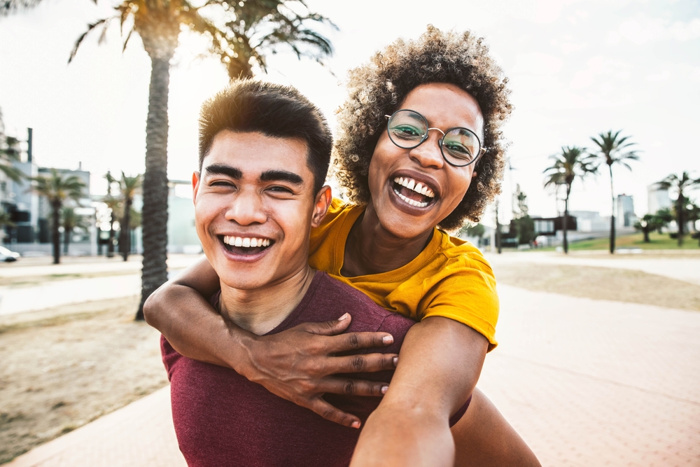 Happy couple taking selfie on summer vacation to Florida.