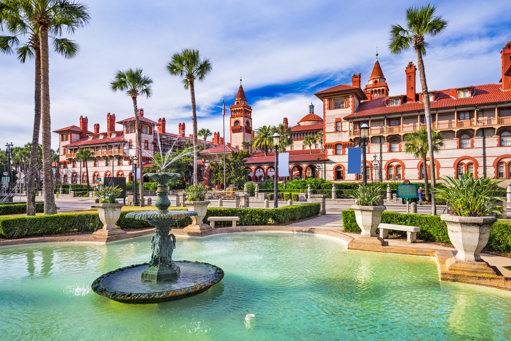 St. Augustine, Florida, town square and fountain with palm trees rising to the sky.