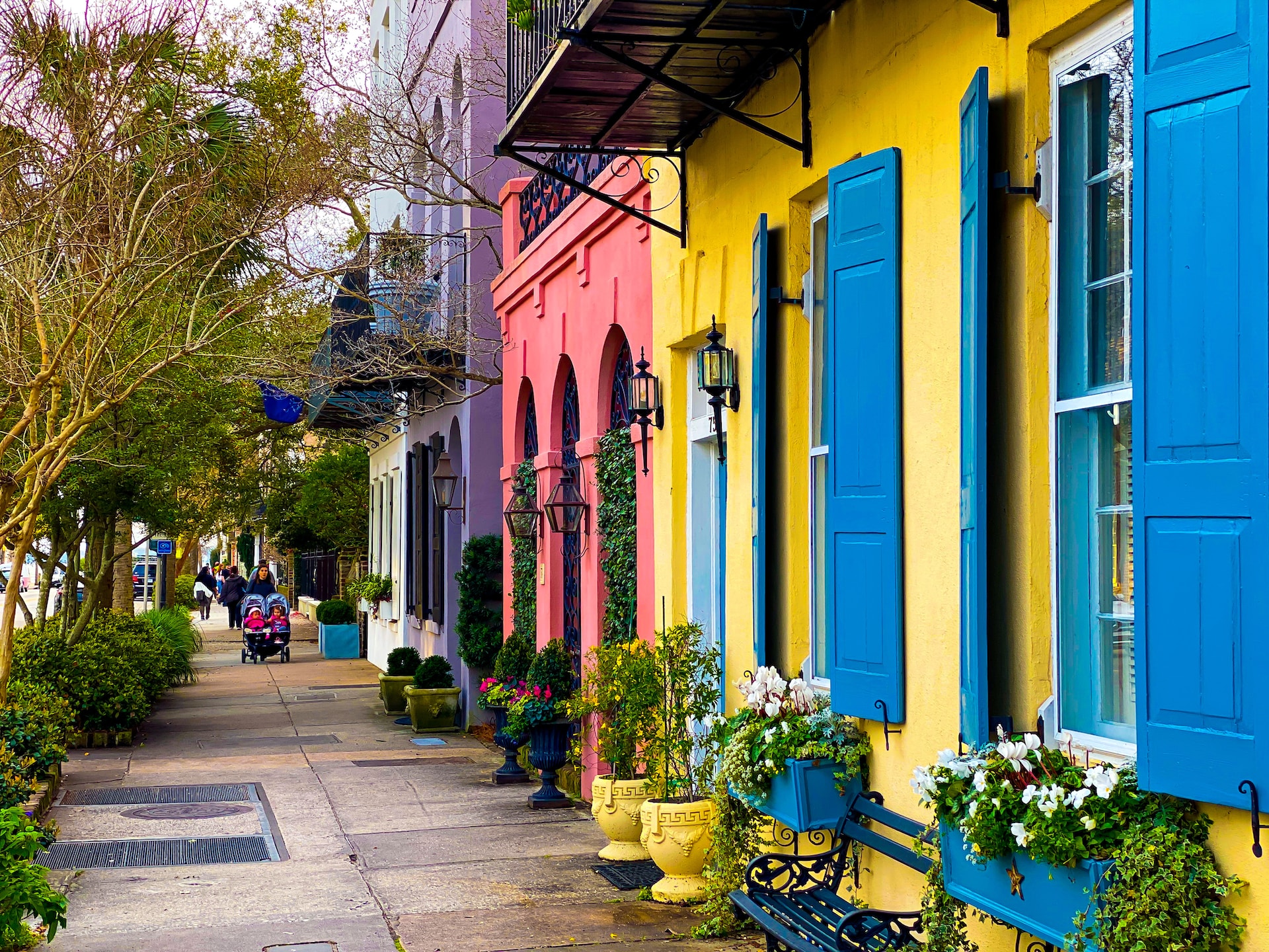 Colorful houses along a busy road in Charleston, South Carolina.