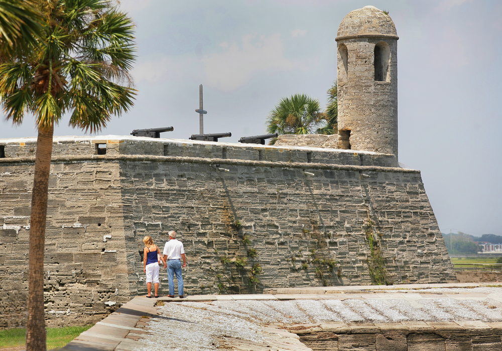 A couple peers at the Castillo de San Marcos.