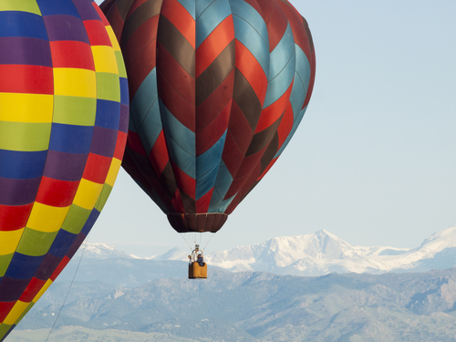 Two colorful hot air balloons in Colorado.