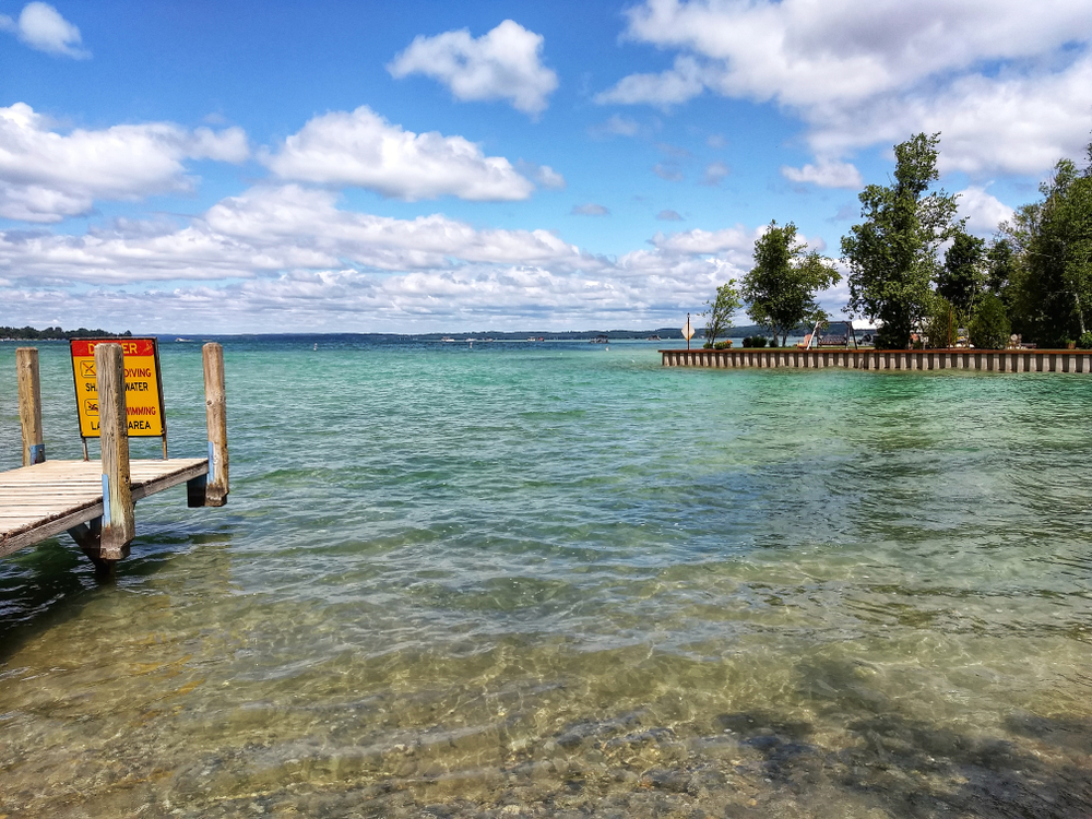 Torch Lake in Michigan — summertime fun in the sun and clear blue water.
