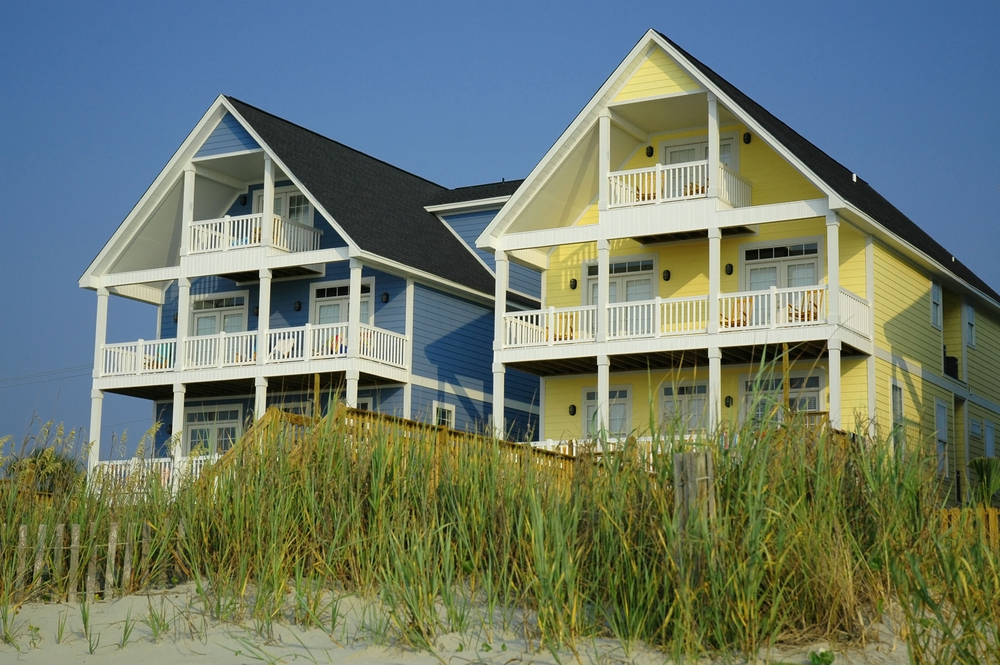 Two pretty beach rental cottages with multiple floors.