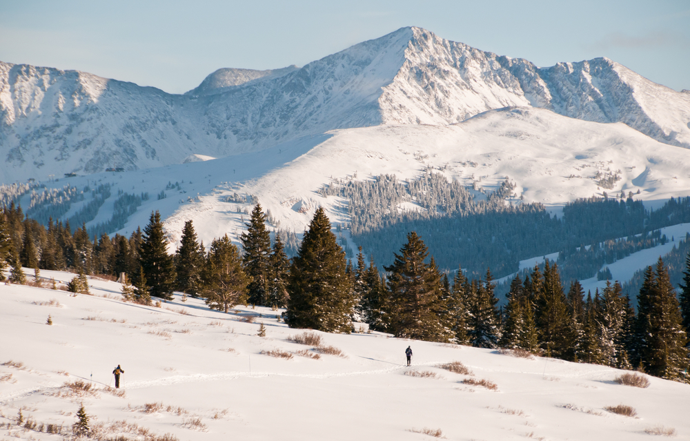 People walking around in Colorado's snowy backcountry.