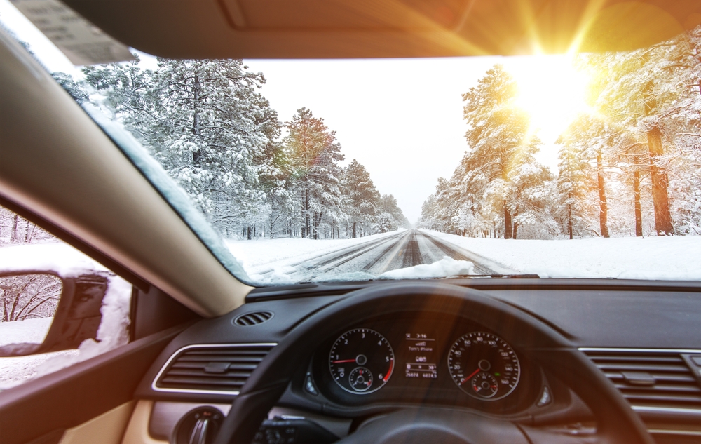 car-driving-through-snow