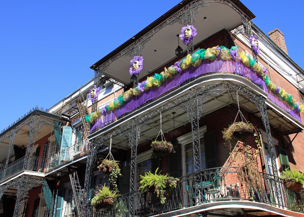 Typical French Quarter wrought iron balconies in preparation for Mardi Gras.