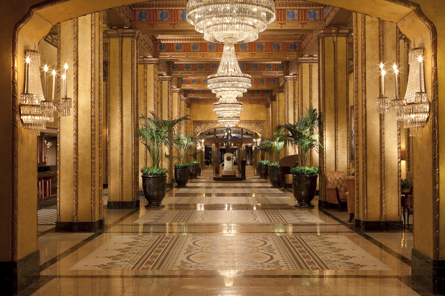 The Roosevelt New Orleans Waldorf Astoria lobby with golden overtones.