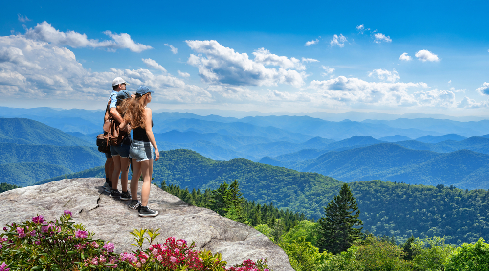 family-standing-on-ridge