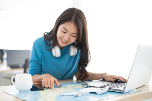 woman-looking-at-world-map