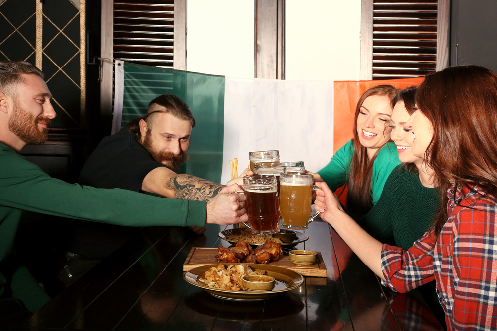 People celebrating Saint Patrick's Day in pub.