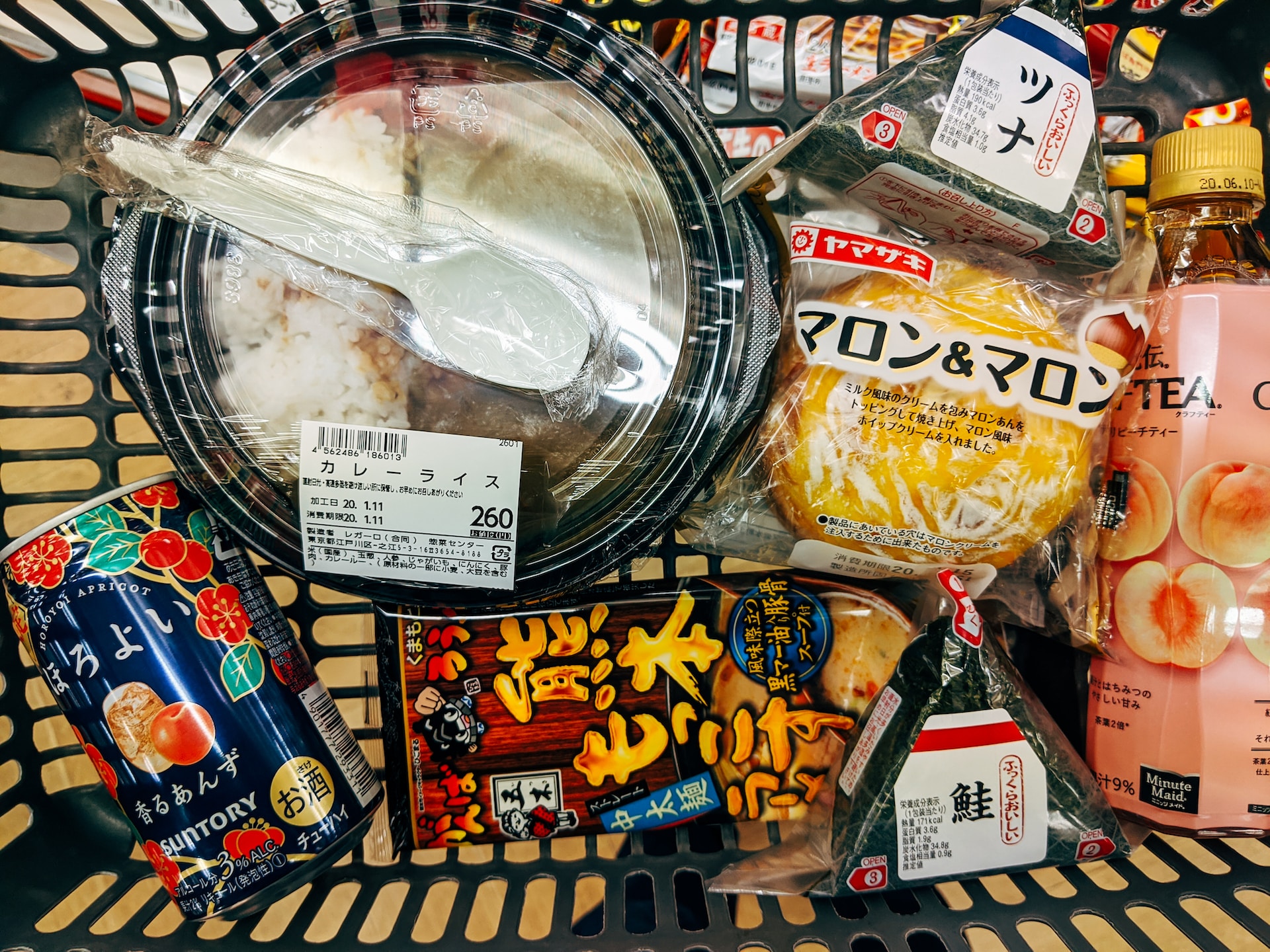 A shopping cart full of candy and things to eat.