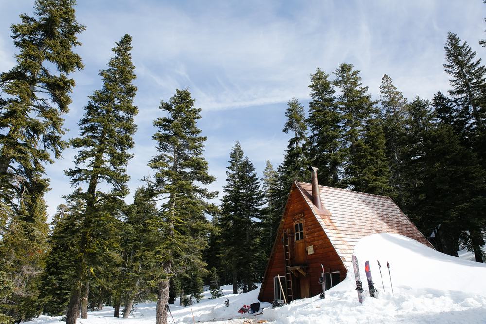 Wooden mountain ski hut in winter in the forests of Lake Tahoe.