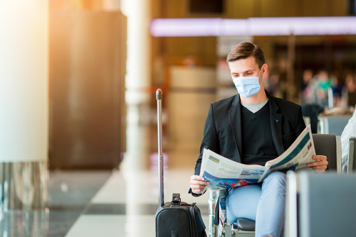 man-in-mask-at-airport