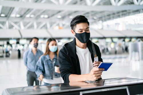 man-checking-in-at-airport