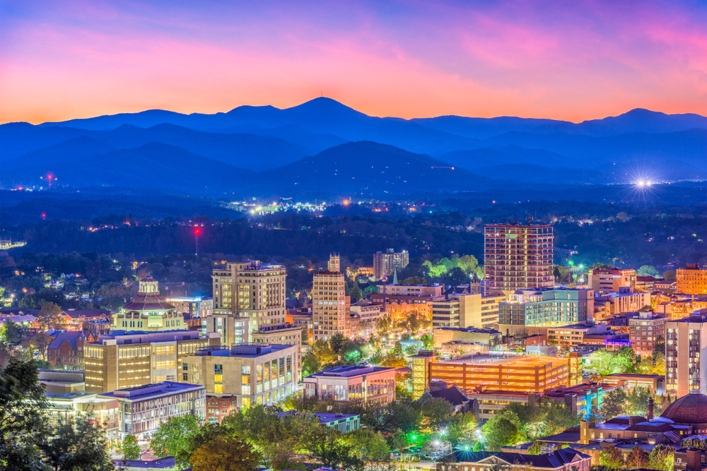 Asheville, North Carolina, skyline over downtown with the Blue Ridge Mountains in the background.
