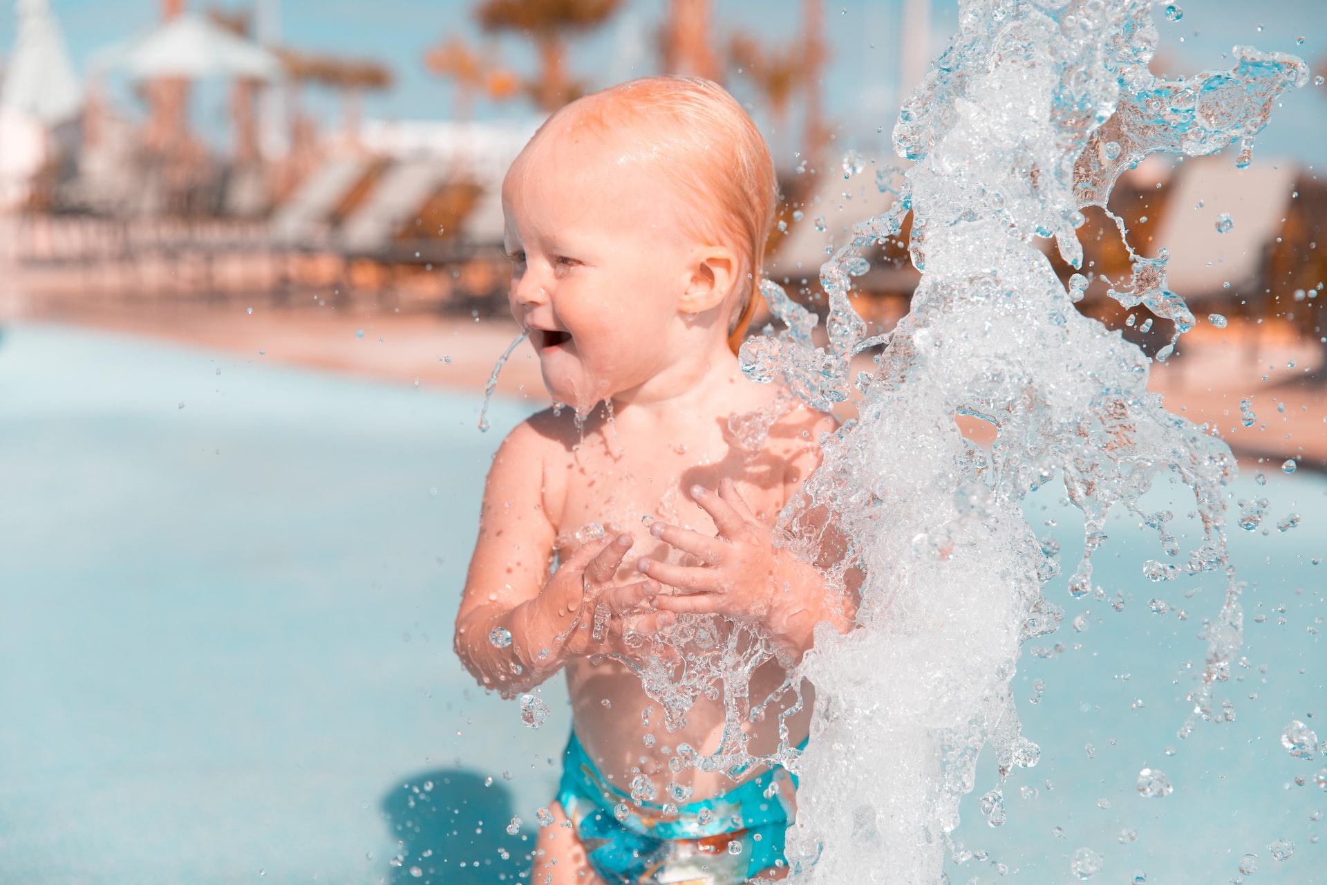 An infant at a waterpark.