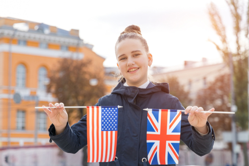 girl-holding-uk-and-us-flag