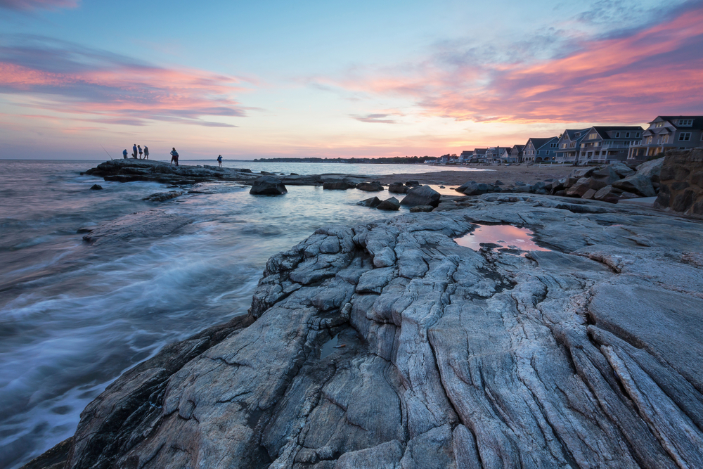 A compelling sunset with pink hues on the Long Island Sound in Madison, Connecticut.