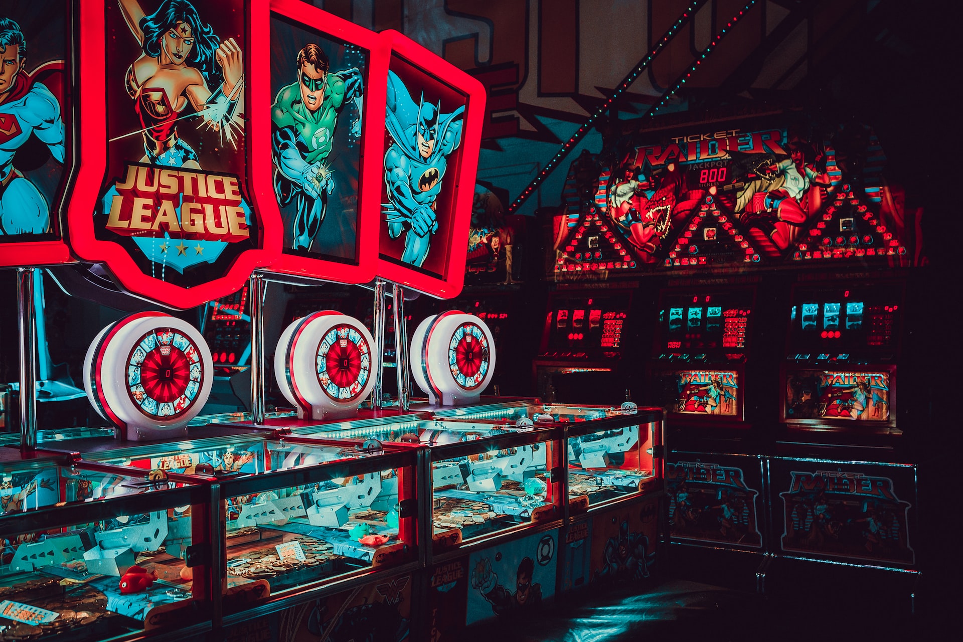 A dark arcade with neon games.