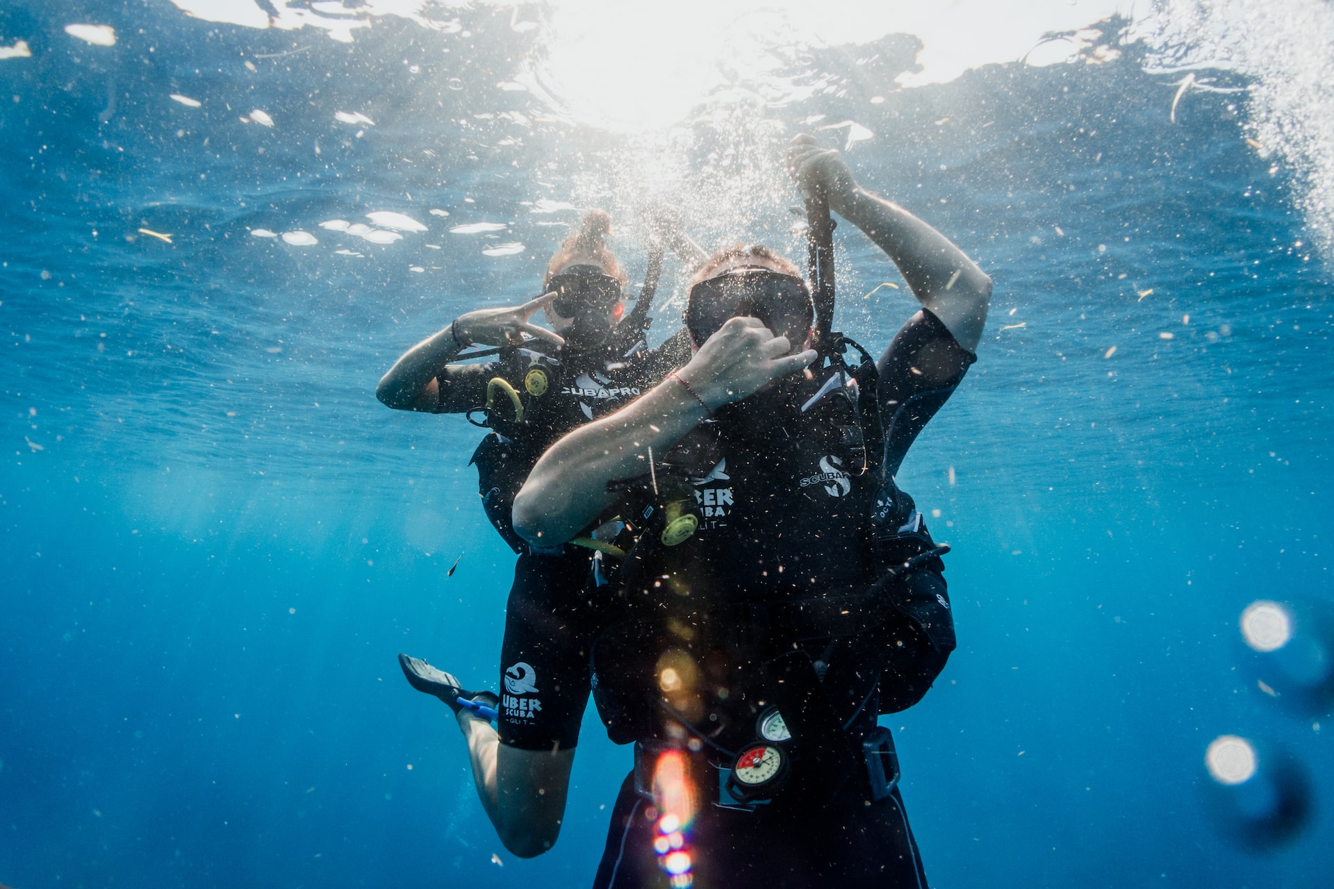 Two scuba divers in the water.