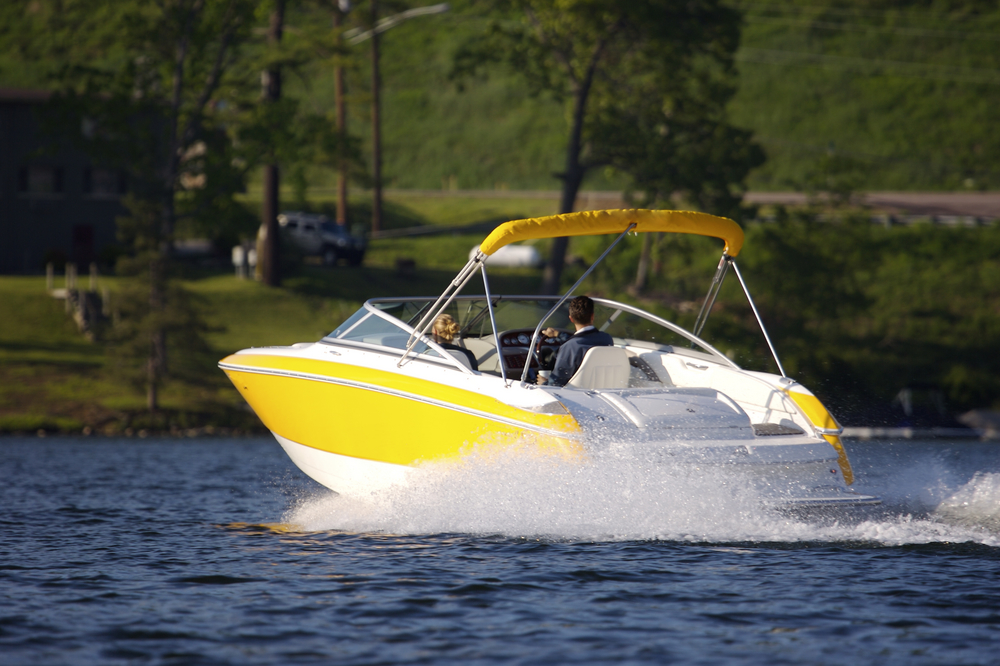 A yellow boat on a lake.