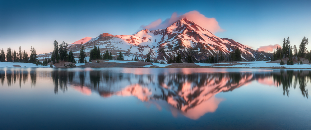 Summer Sunrise South Sister mountains in central Oregon near Bend are reflected in Green Lakes.