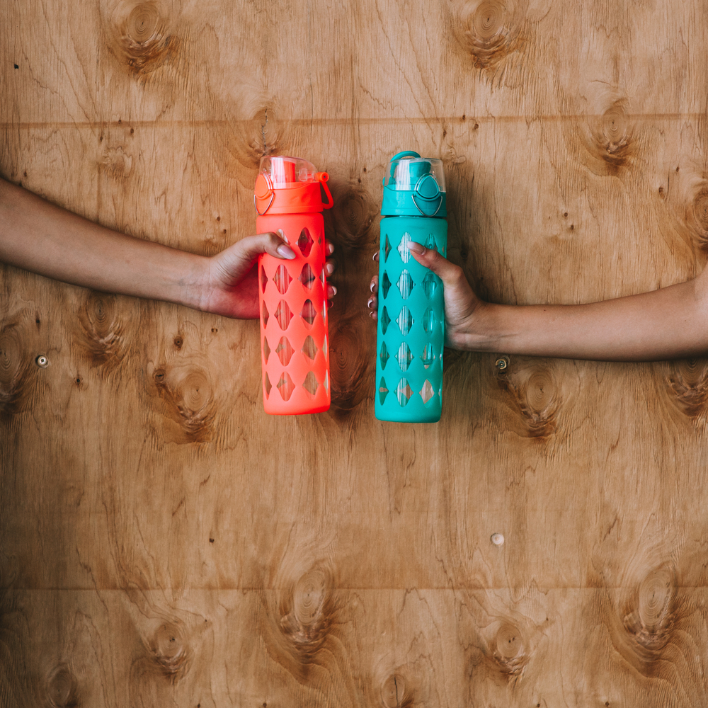 hands-holding-water-bottles