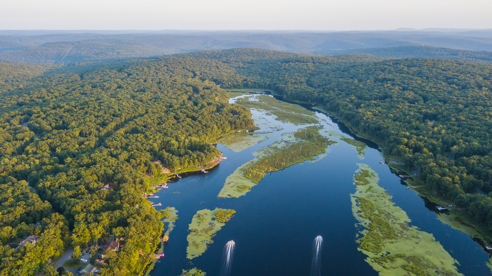 Two boats cruising along Lake Wallenpaupack as seen from the air.