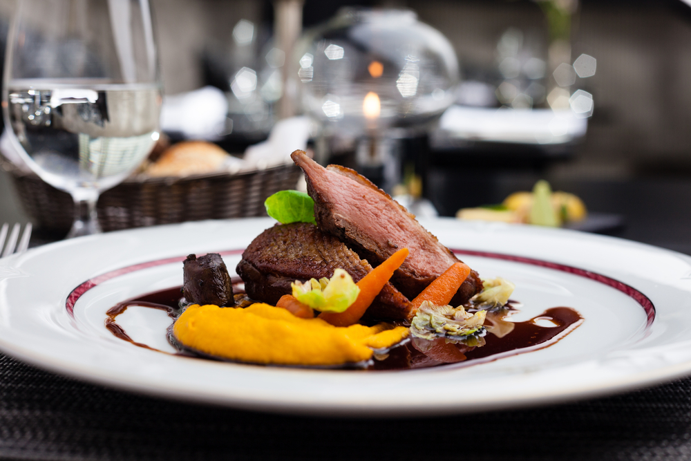 Roasted duck fillet with carrot-orange puree, slow-cooked duck heart and prune sauce.