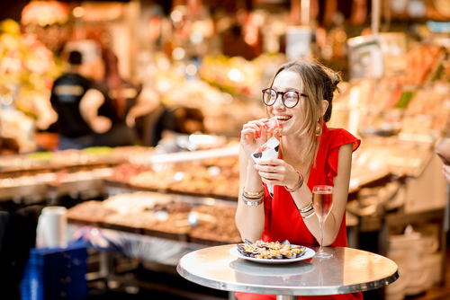 woman-enjoying-food-in-barcelona