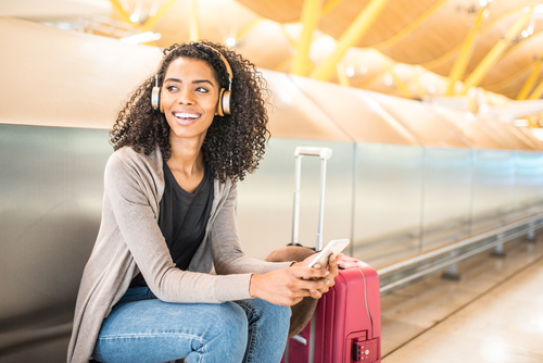 woman-with-headphones-at-airport