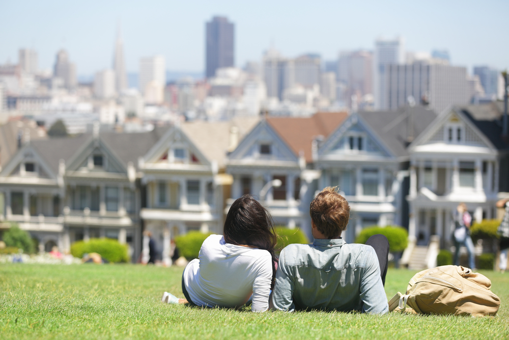 A couple posing together in Alamo Square.