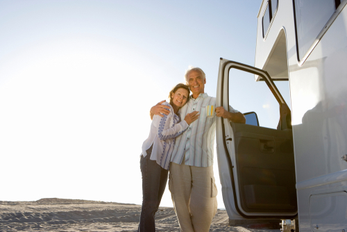 couple-smiling-with-rv