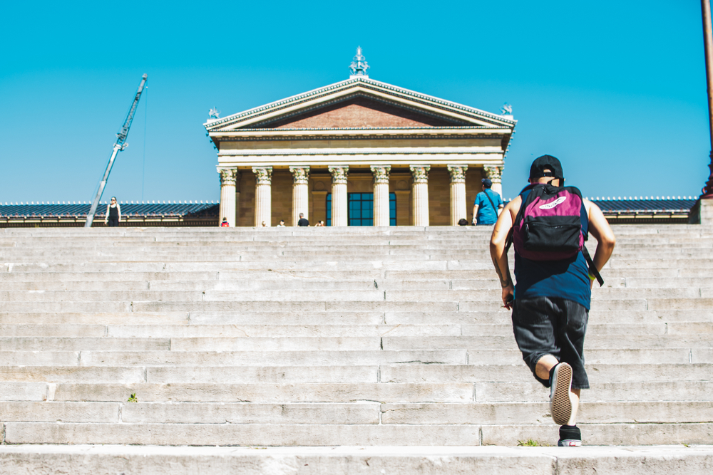 A person running the Rocky Steps in Philly.