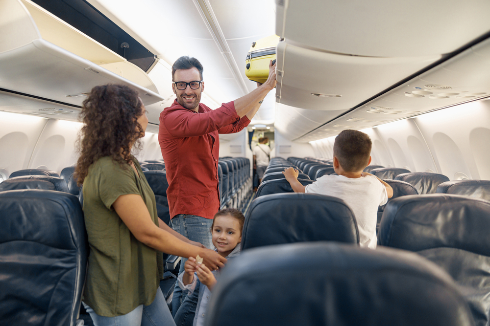 Family going on a trip traveling on an airplane.