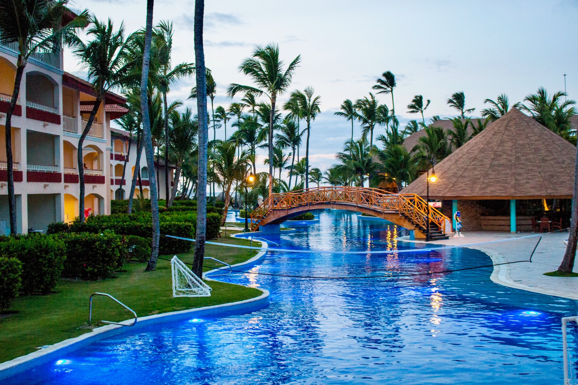 Lazy river-like pool with palm trees poking out here and there at a resort in Punta Cana.