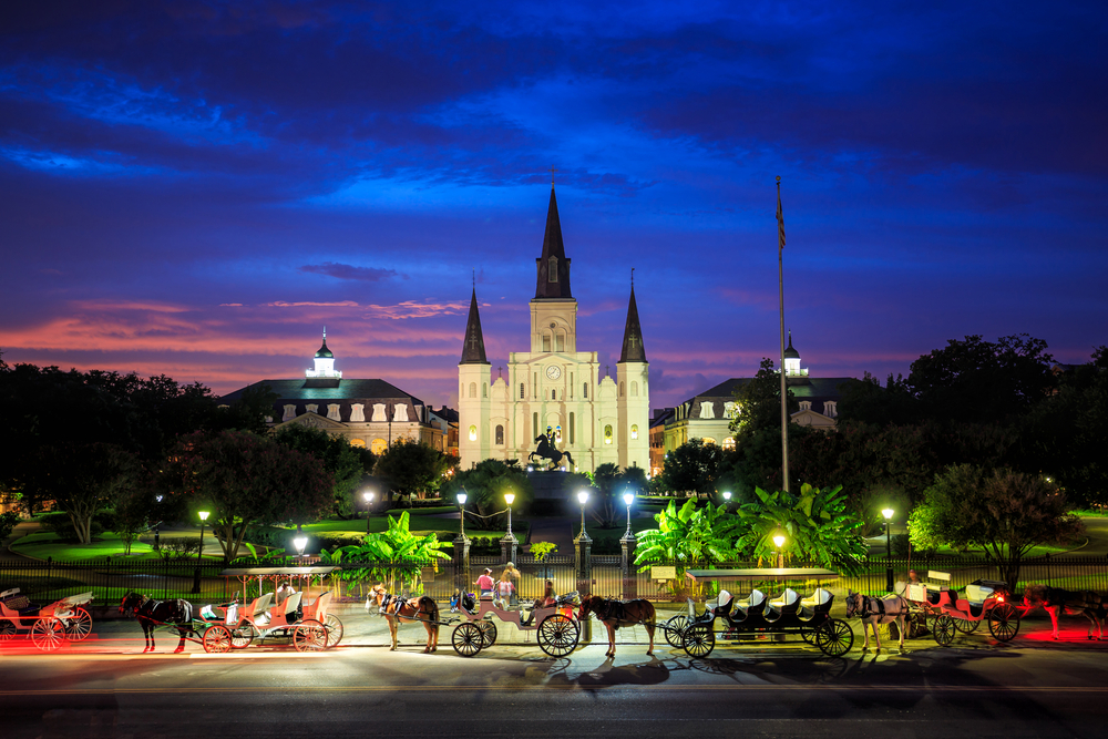 Saint Louis Cathedral and Jackson Square in New Orleans, Louisiana at sunset.