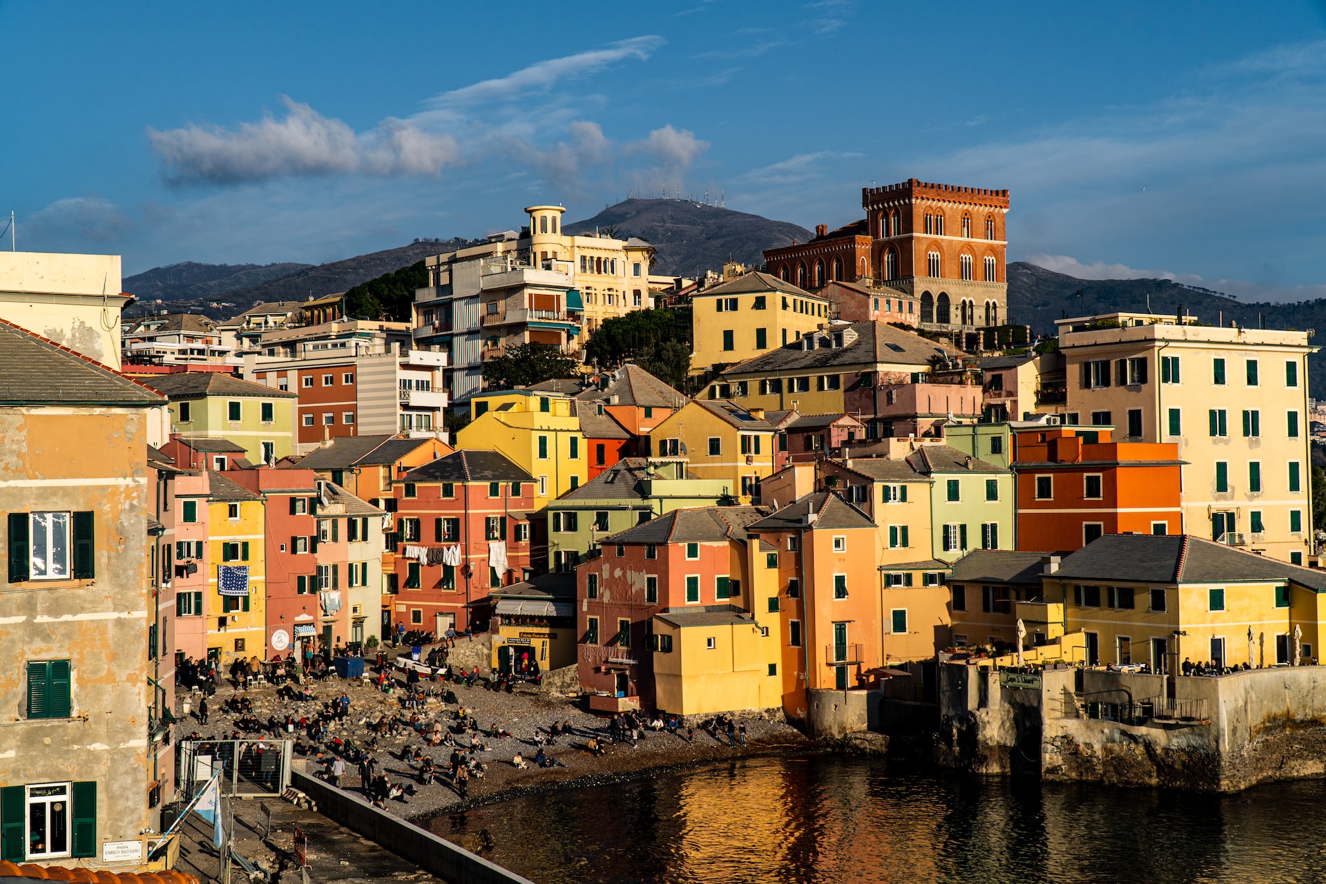 Multi-colored buildings along the waterfront in Genoa.