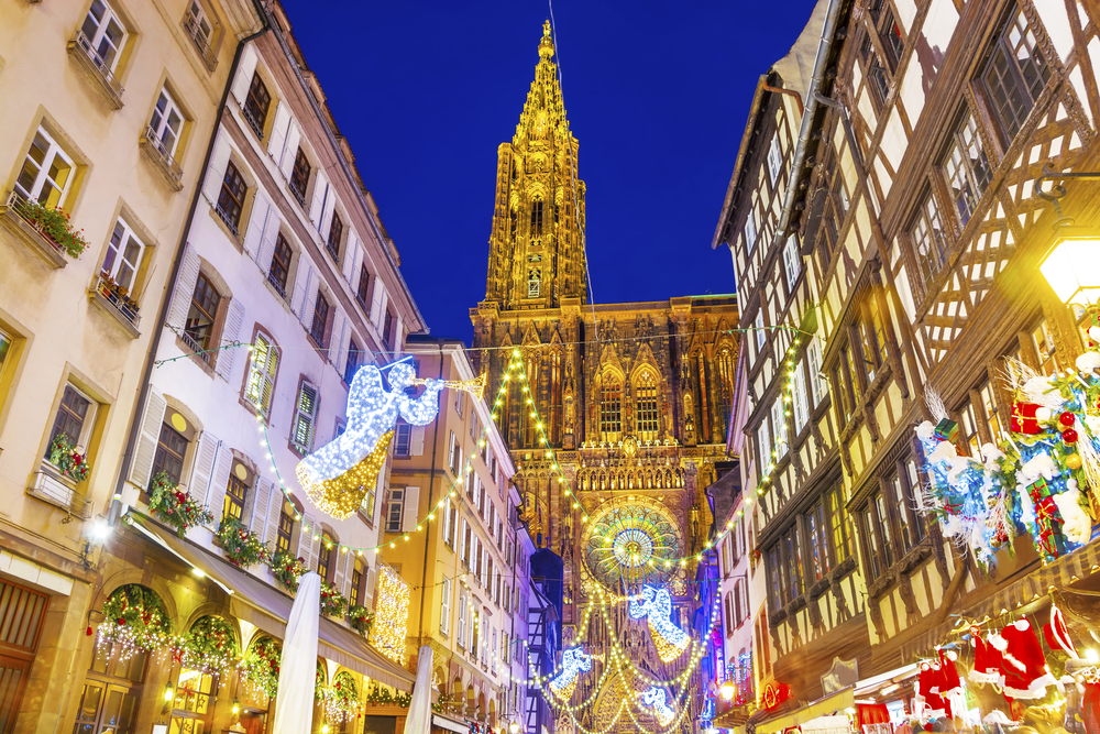 Straousbourg's city center full of buildings covered in Christmas lights.