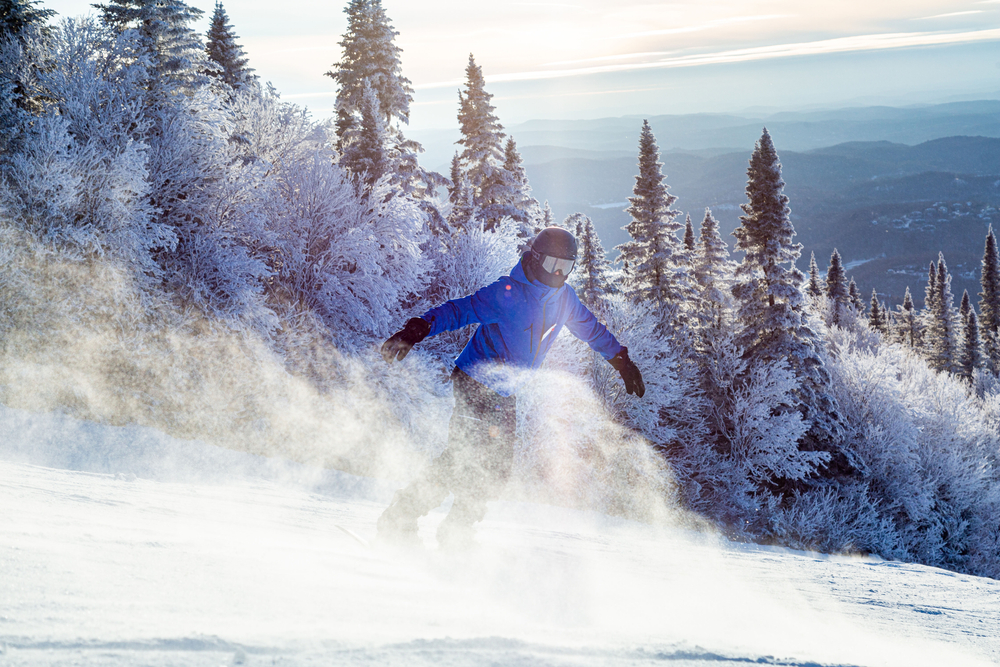 Snowboarder with a frosty air of snow at a  Canadian ski resort.