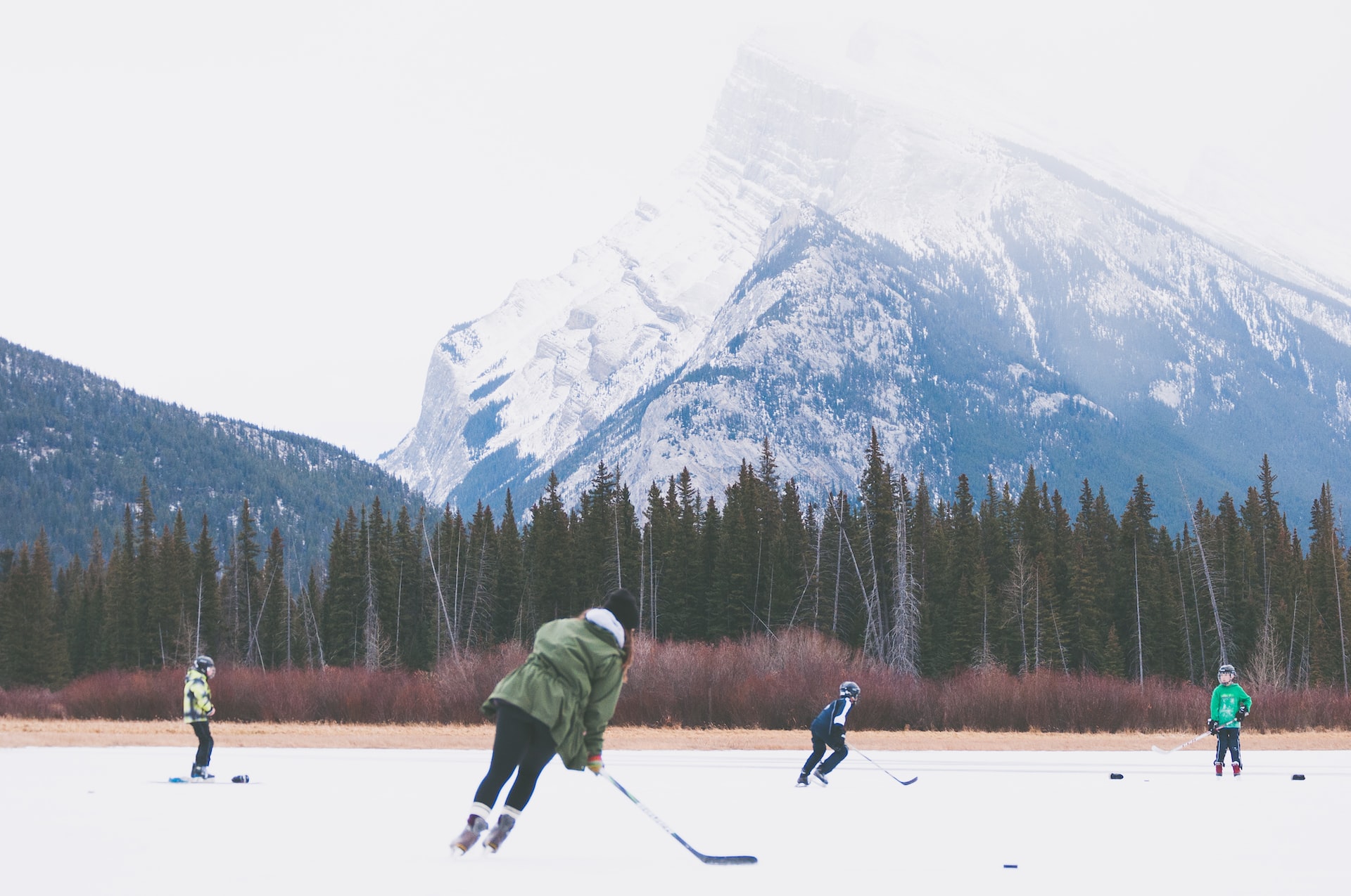 Children playing ice hockey in Banff.