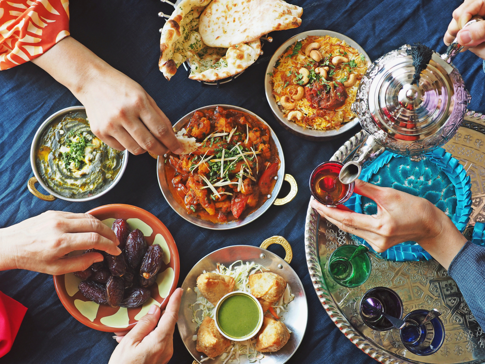 An array of Middle Eastern food arranged on a table.