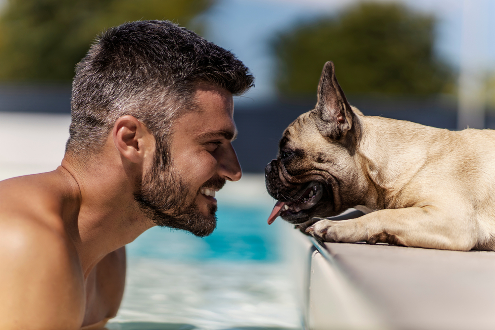 man-and-his-pup-poolside